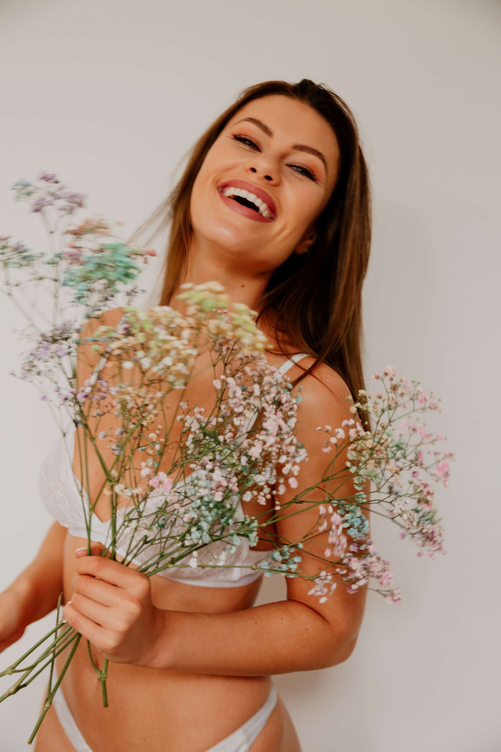 confident girl with flowers