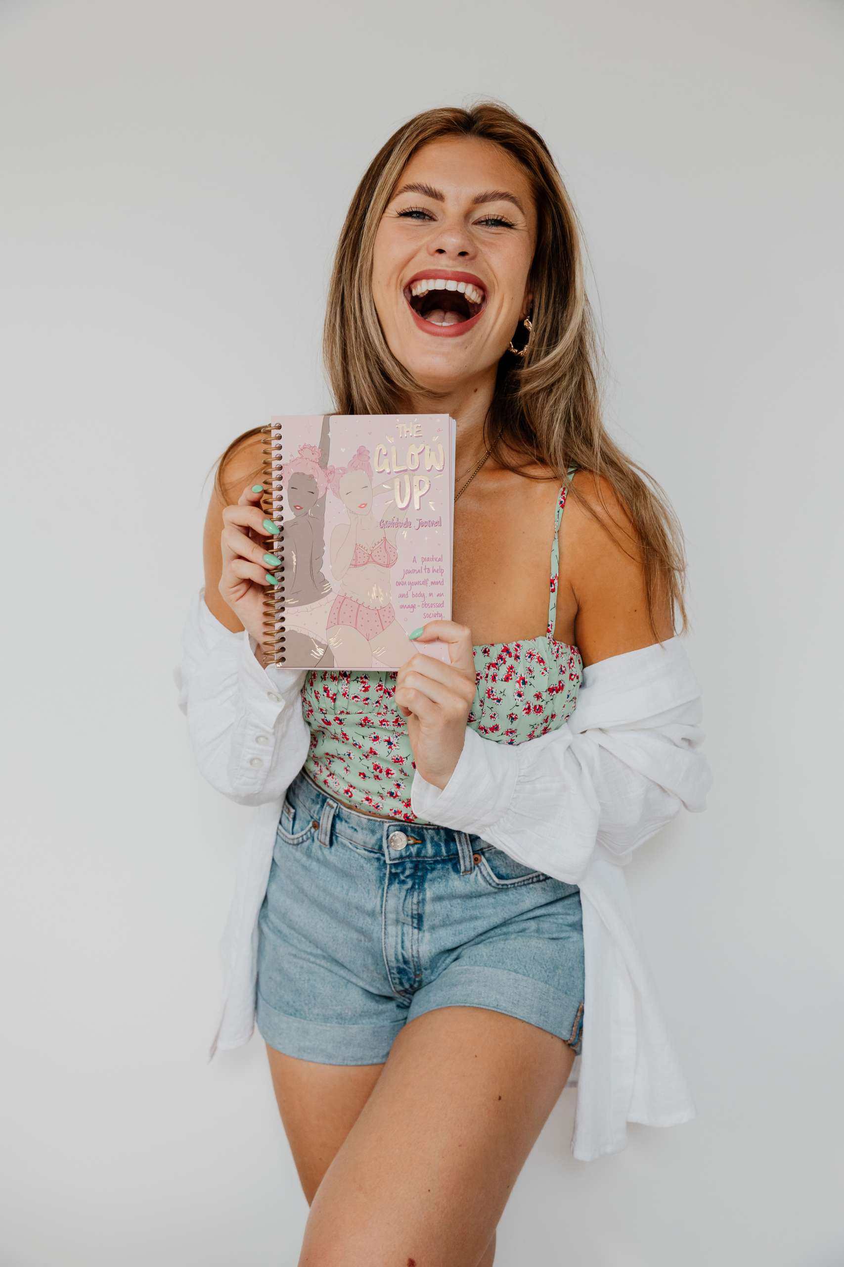 young girls smiles with a confidence journal
